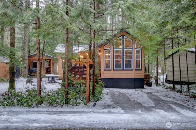 view of property exterior with an outbuilding