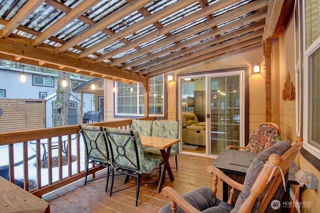 sunroom featuring vaulted ceiling