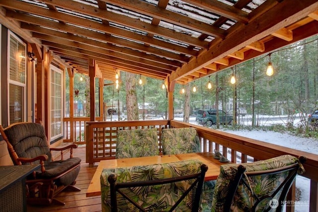 wooden deck with outdoor dining space and a pergola