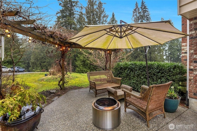 view of patio / terrace featuring an outdoor living space with a fire pit and a pergola