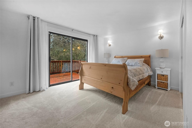 bedroom with baseboards, light colored carpet, and access to exterior