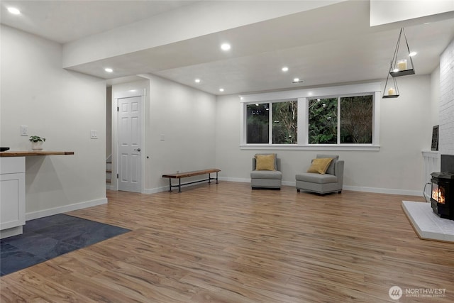 unfurnished room featuring light wood-style floors, baseboards, and recessed lighting