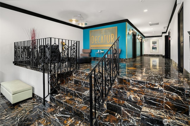 hallway with marble finish floor, ornamental molding, visible vents, and recessed lighting