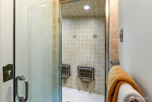 bathroom featuring a stall shower and recessed lighting