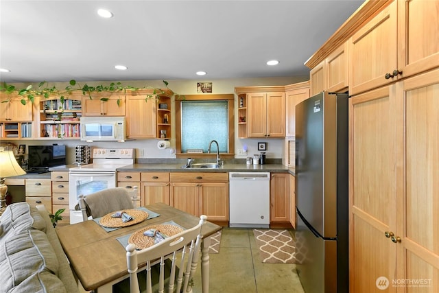 kitchen featuring open shelves, white appliances, a sink, and light brown cabinetry