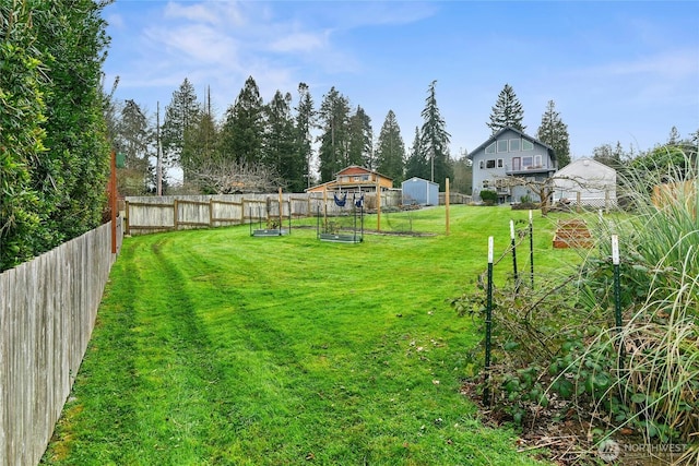 view of yard featuring a garden and fence