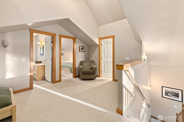 bonus room with carpet, baseboards, and vaulted ceiling