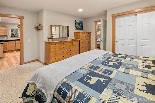 bedroom featuring recessed lighting, a closet, and baseboards