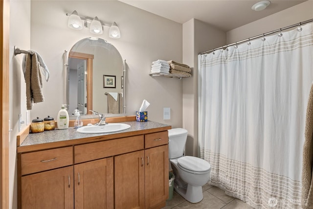 full bathroom featuring toilet, a shower with curtain, tile patterned flooring, and vanity