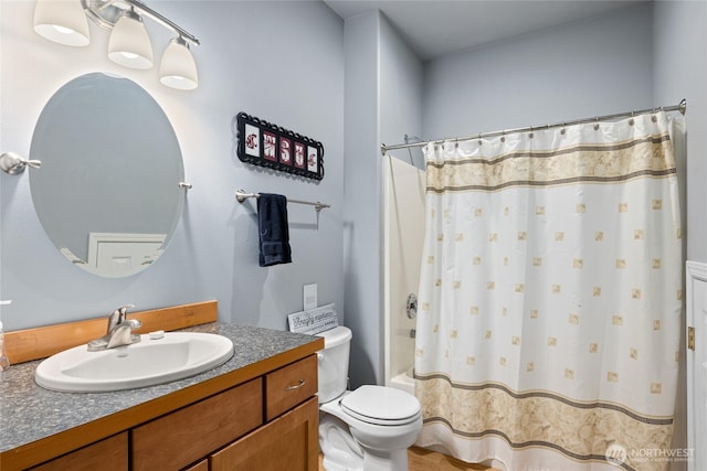 full bath featuring toilet, shower / bath combo, and vanity