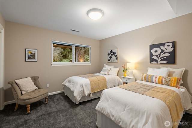 bedroom featuring radiator, visible vents, dark carpet, and baseboards