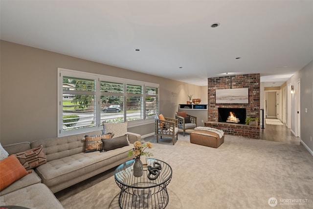 carpeted living room featuring a fireplace, baseboards, and recessed lighting