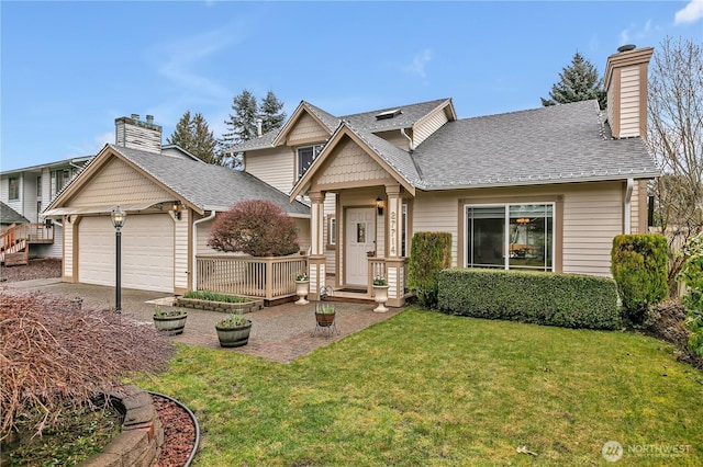 view of front facade with roof with shingles, a chimney, concrete driveway, an attached garage, and a front lawn