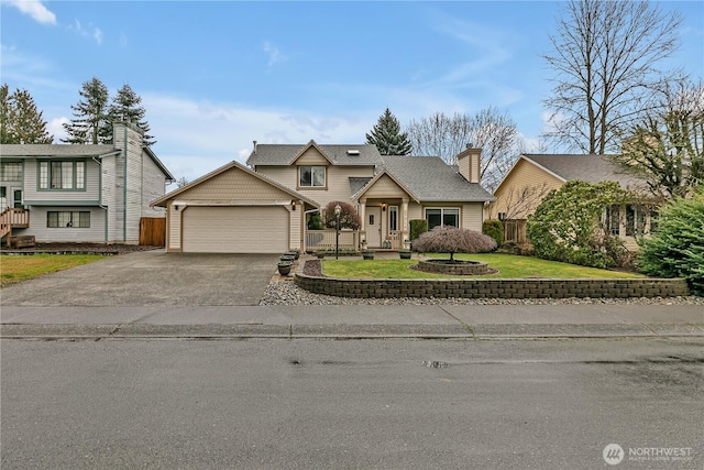 traditional-style house with aphalt driveway, a front yard, fence, and an attached garage