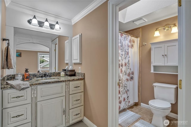 bathroom with toilet, vanity, baseboards, ornamental molding, and tile patterned floors