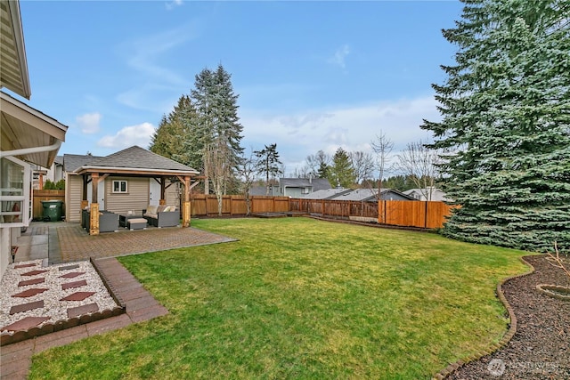 view of yard featuring a patio area, outdoor lounge area, a fenced backyard, and a gazebo