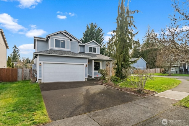 traditional-style house with aphalt driveway, a garage, a front lawn, and fence