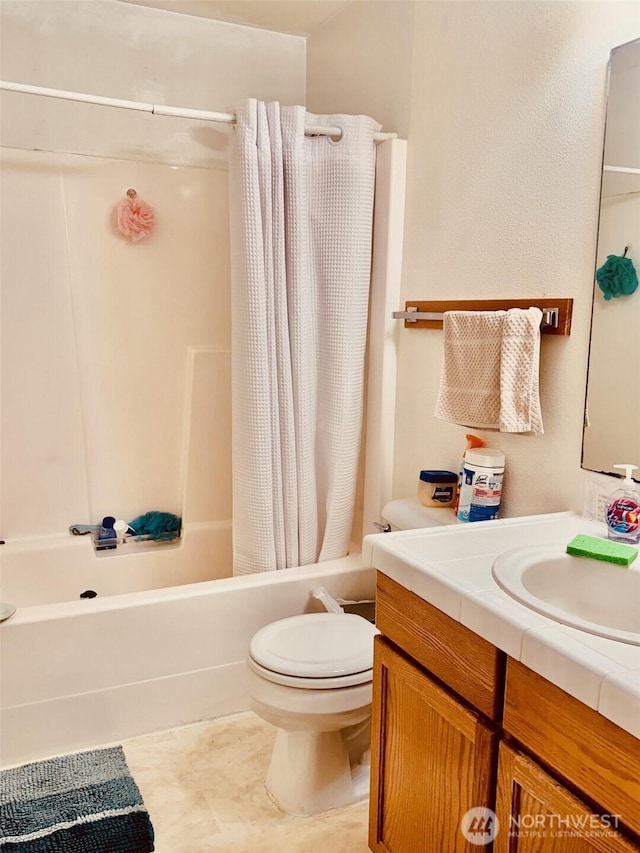 bathroom with toilet, shower / bathtub combination with curtain, and vanity