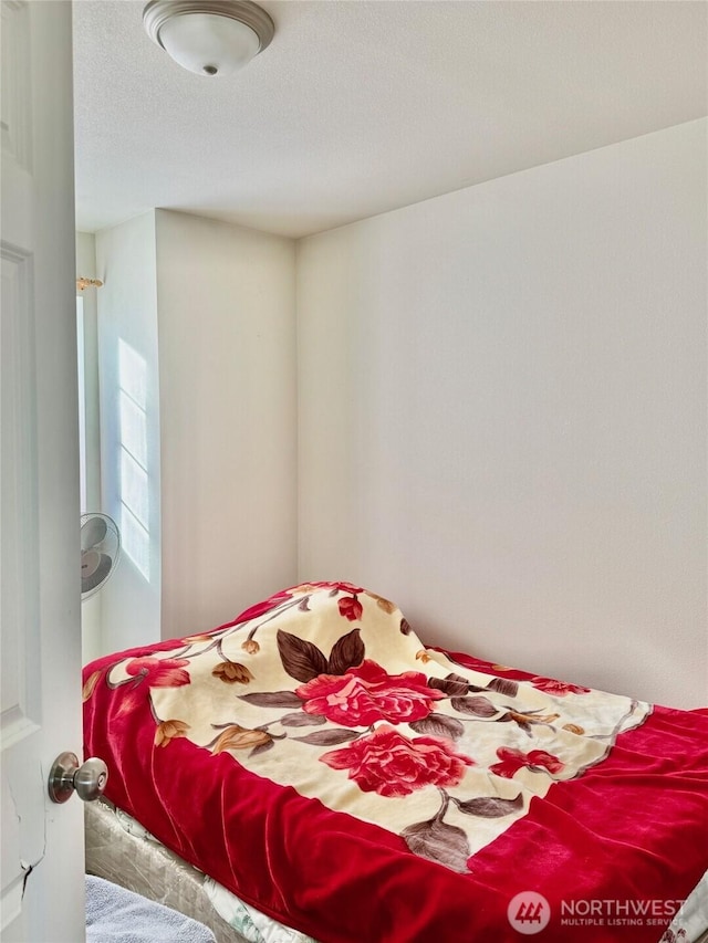 bedroom featuring a textured ceiling