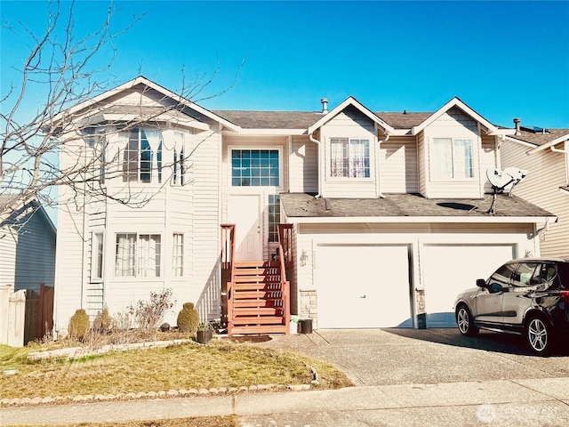 view of front of property with driveway and an attached garage