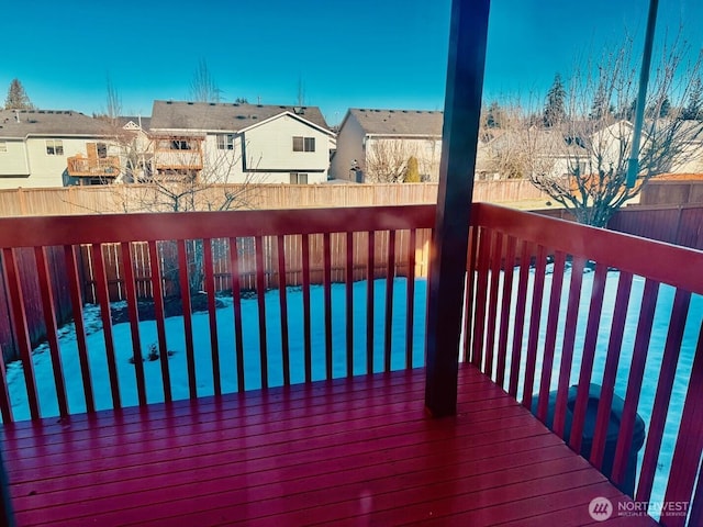 deck with a fenced backyard and a residential view