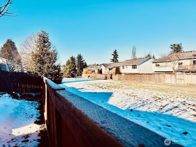 view of yard with a residential view and fence