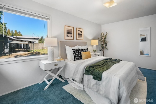 bedroom featuring carpet flooring and baseboards