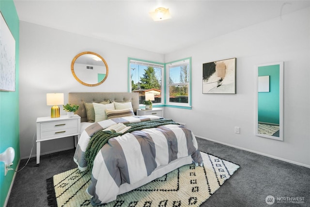 bedroom featuring carpet and baseboards