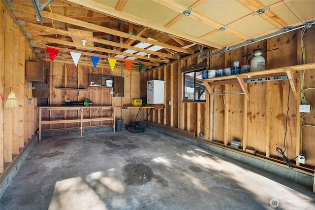 interior space with a garage and electric panel