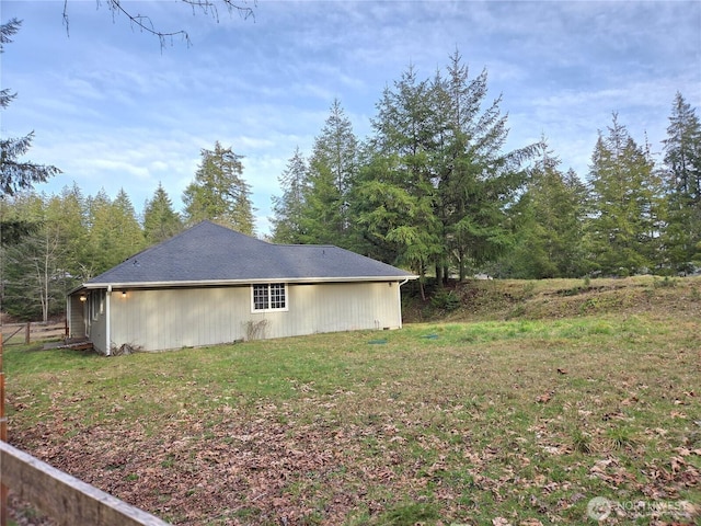 view of property exterior with a yard