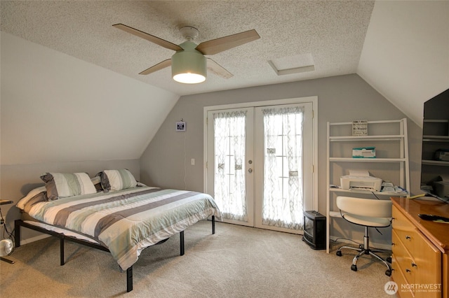 bedroom featuring access to exterior, carpet, vaulted ceiling, and a textured ceiling