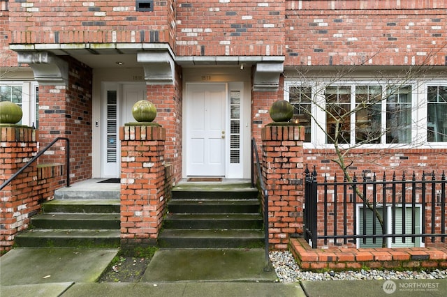 entrance to property with brick siding