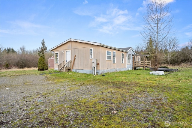 view of home's exterior featuring entry steps, crawl space, and a wooden deck