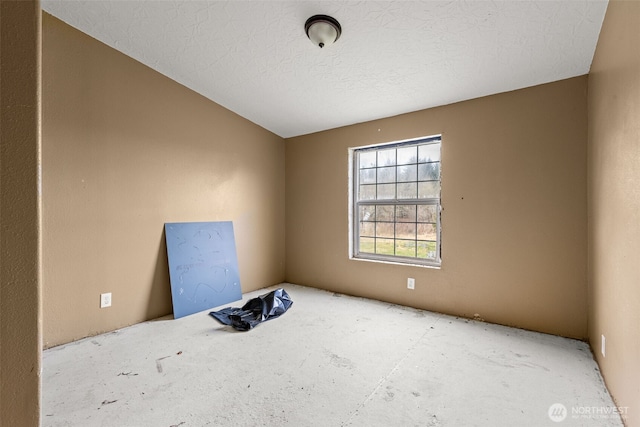 empty room featuring a textured ceiling