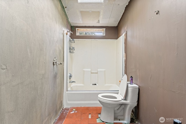 bathroom with toilet and shower / washtub combination