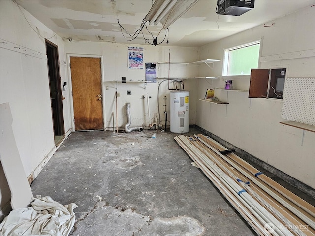 garage featuring a garage door opener and electric water heater