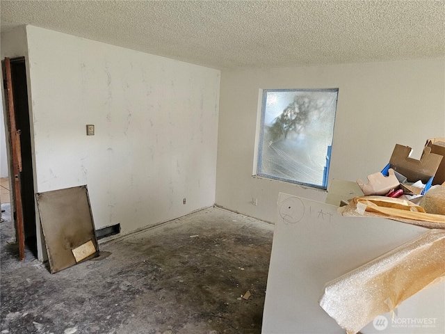 interior space with a textured ceiling