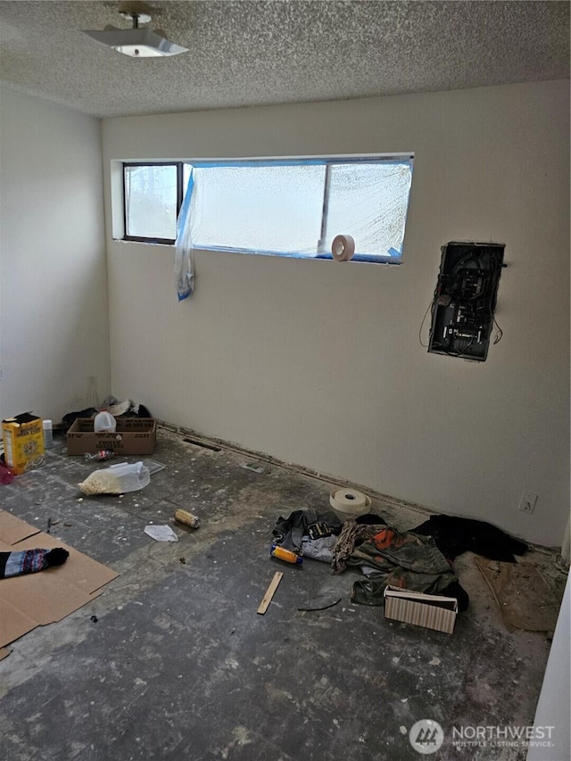 interior space featuring a textured ceiling