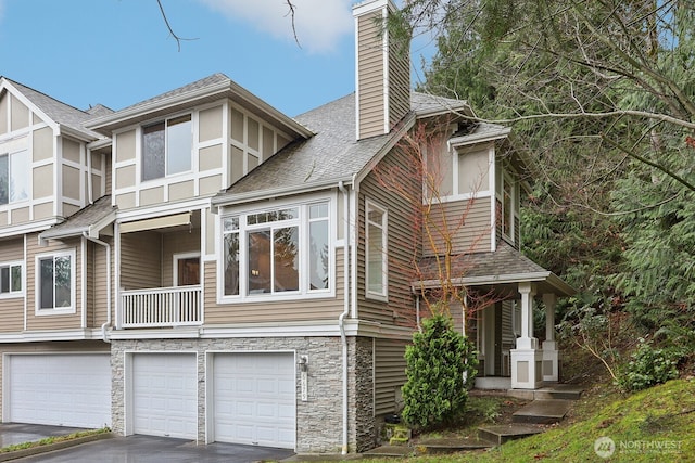 view of property exterior featuring driveway, a garage, a shingled roof, stone siding, and a chimney