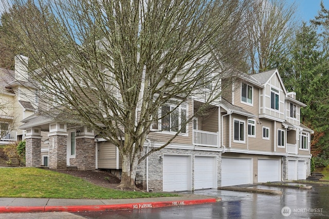 view of front of property with stone siding and a front lawn