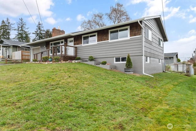 ranch-style home with fence, a chimney, and a front lawn