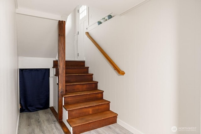 stairs with wood finished floors