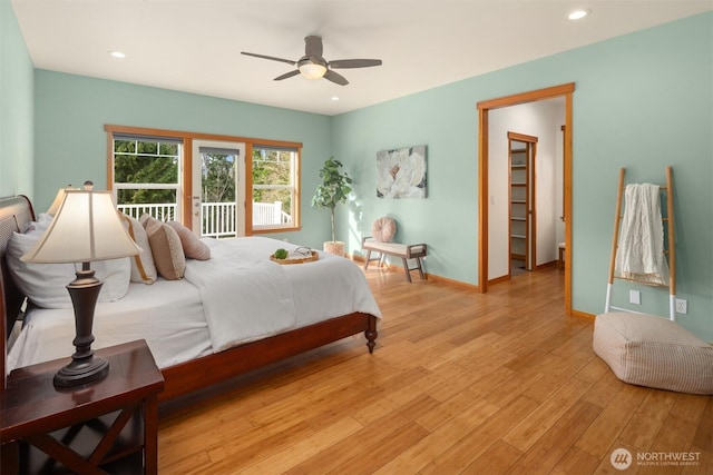 bedroom featuring recessed lighting, light wood-style floors, a ceiling fan, access to outside, and baseboards