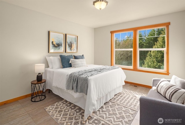 bedroom featuring baseboards