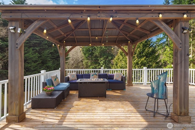 deck featuring an outdoor living space and a gazebo