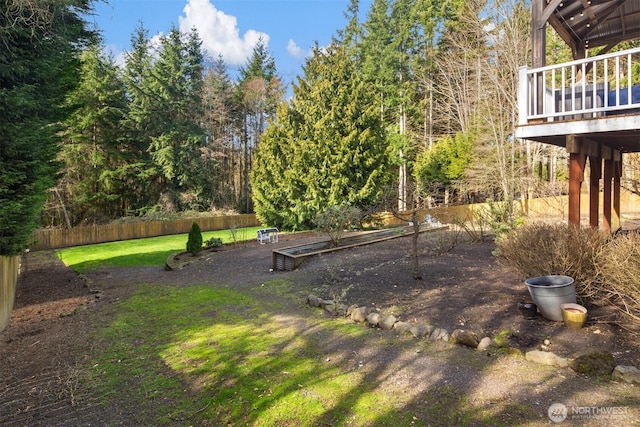 view of yard with a vegetable garden and fence