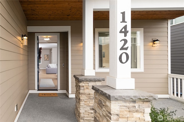 property entrance featuring covered porch