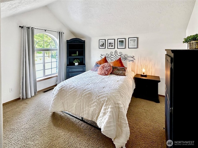 carpeted bedroom featuring visible vents, baseboards, vaulted ceiling, and a textured ceiling