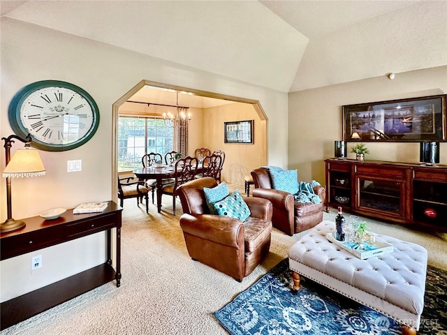 carpeted living area with lofted ceiling, arched walkways, and a notable chandelier