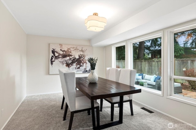 dining area featuring carpet, visible vents, and baseboards